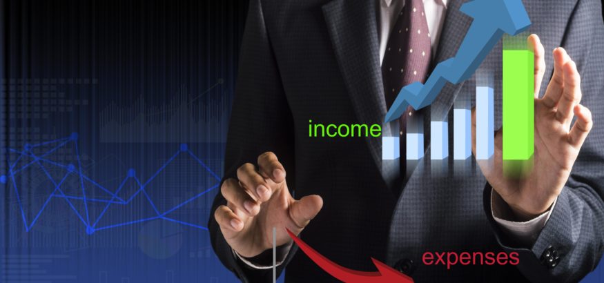 image oh a man's hand hovering near an income expense graph